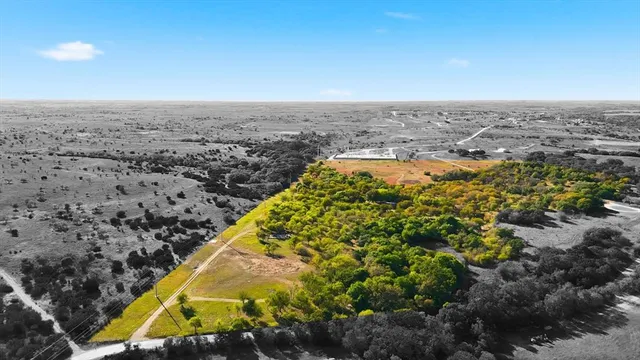 an aerial view of residential building and lake