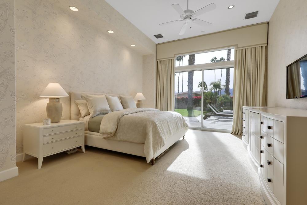 70955 Sunny Lane Rancho Mirage, CA 92270 - Photo 14 of 35 a bedroom with a bed and a large window