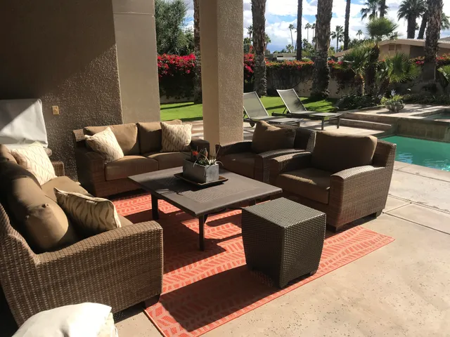 a outdoor living space with furniture and a fire pit