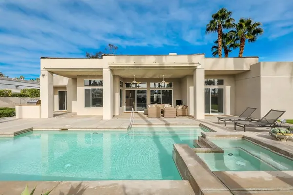 a view of a house with a swimming pool