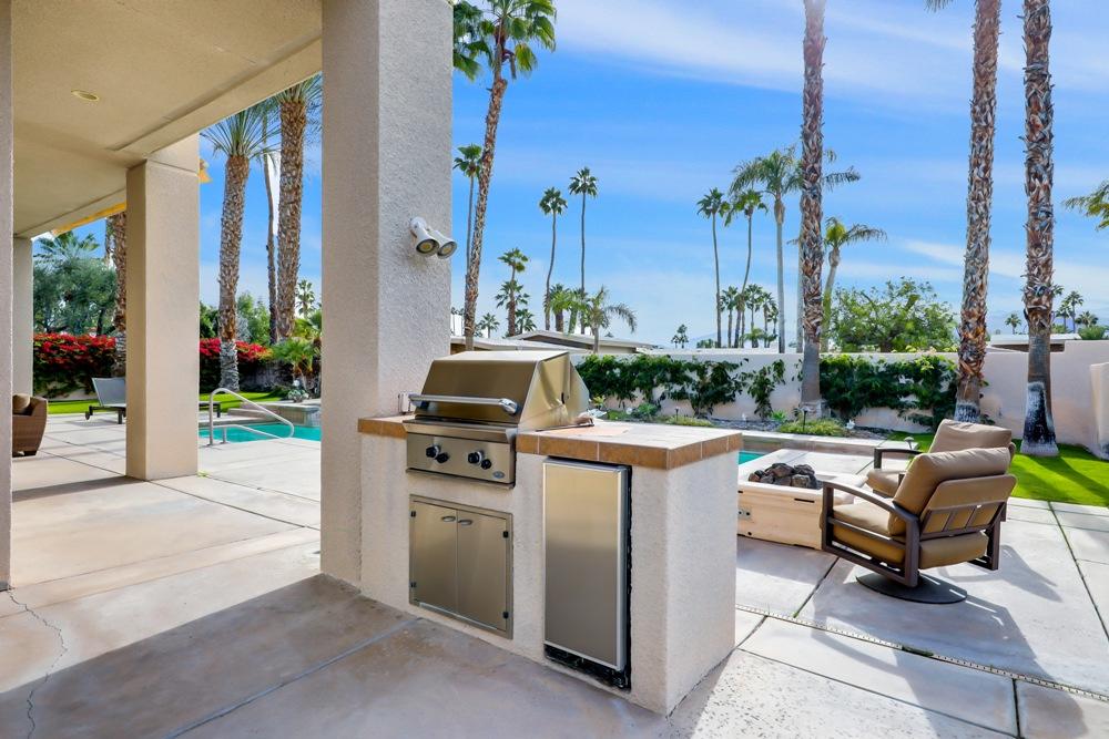 70955 Sunny Lane Rancho Mirage, CA 92270 - Photo 30 of 35 a view of a kitchen with a stove and a chair