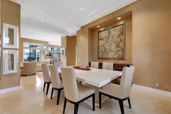 a view of a dining room with furniture large window and wooden floor