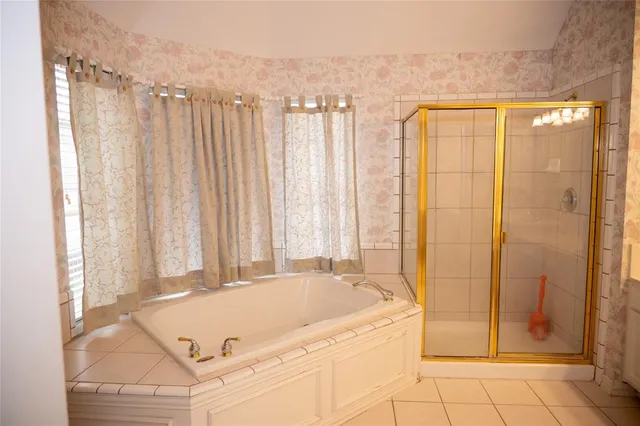 a bathroom with a sink double vanity and a shower