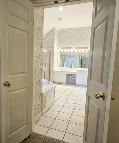 a bathroom with a shower and a sink