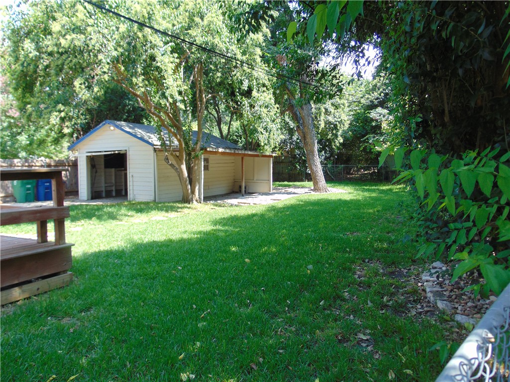 1508 Richcreek Road Austin, TX 78757 - Photo 3 of 10 a white house with a big yard and large trees