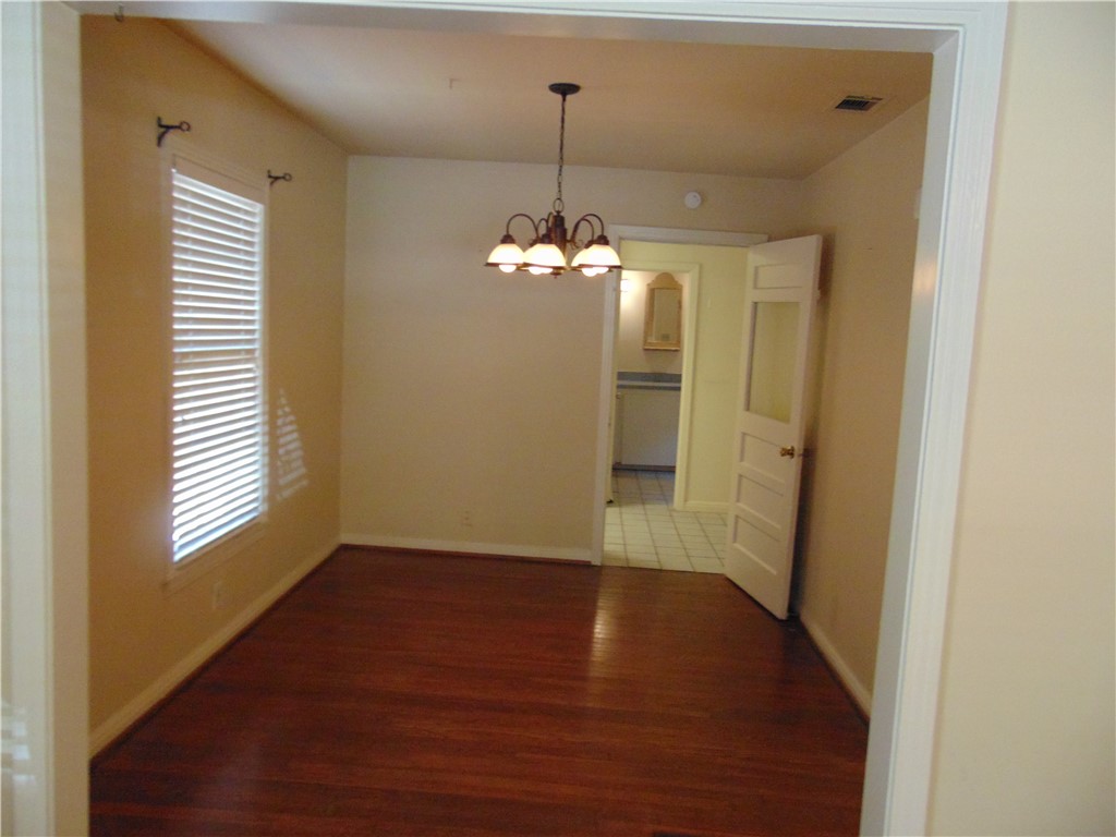1508 Richcreek Road Austin, TX 78757 - Photo 5 of 10 a view of a room with wooden floor and windows