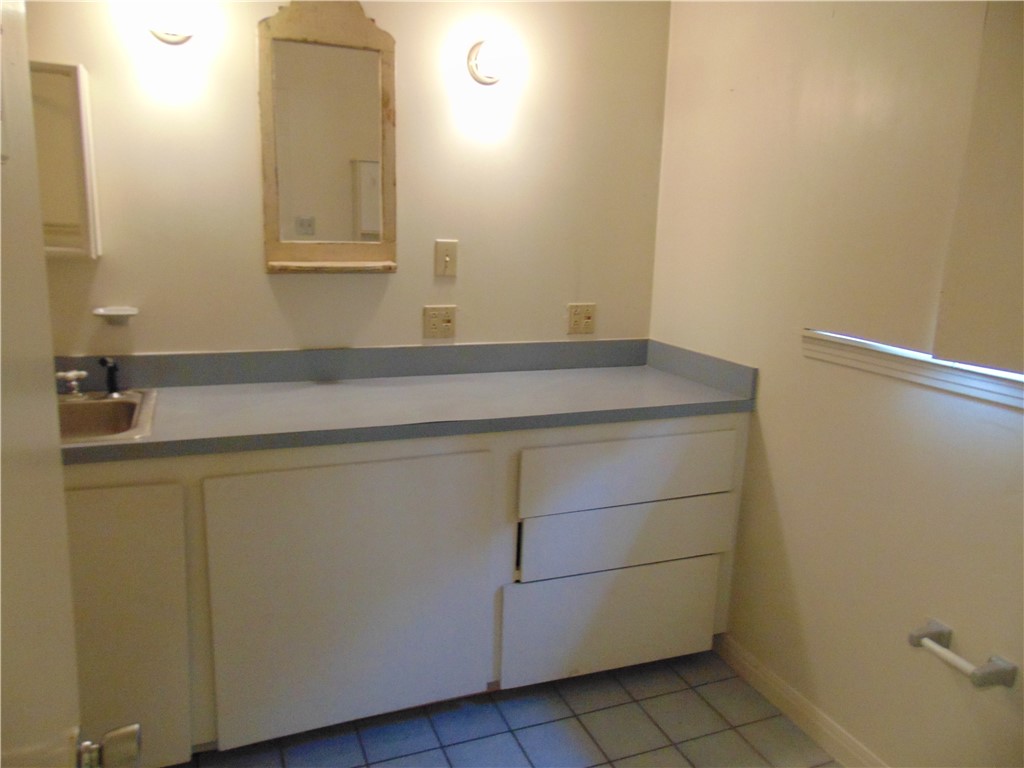 1508 Richcreek Road Austin, TX 78757 - Photo 8 of 10 a bathroom with a sink and vanity