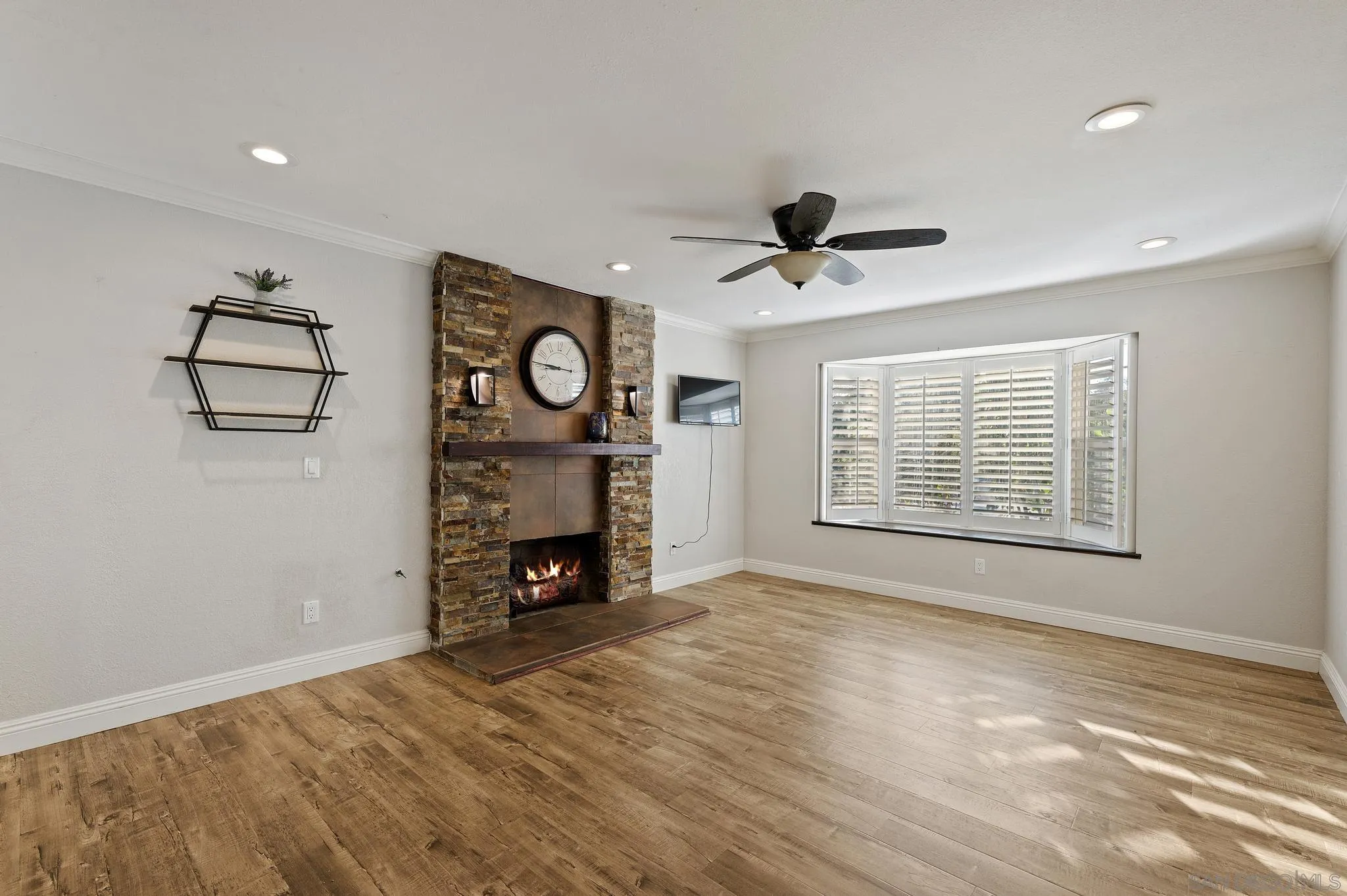 14433 Range Park Road Poway, CA 92064 - Photo 15 of 46 a view of an empty room with a window and a fireplace