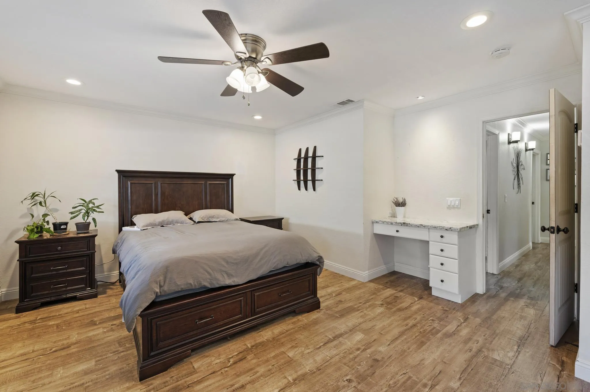 14433 Range Park Road Poway, CA 92064 - Photo 25 of 46 a spacious bedroom with a bed and cabinet