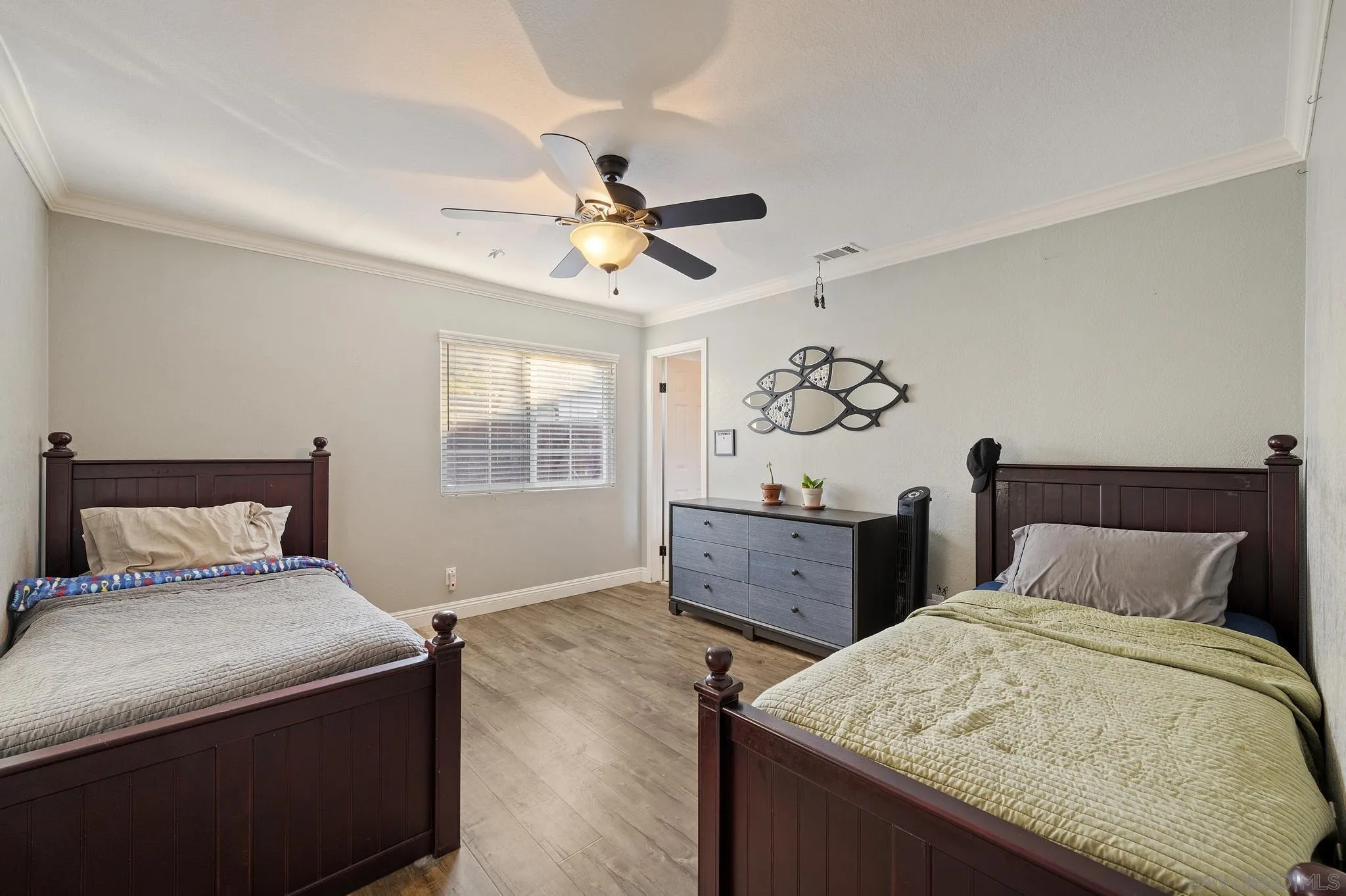 14433 Range Park Road Poway, CA 92064 - Photo 28 of 46 a bedroom with a large bed and a chandelier