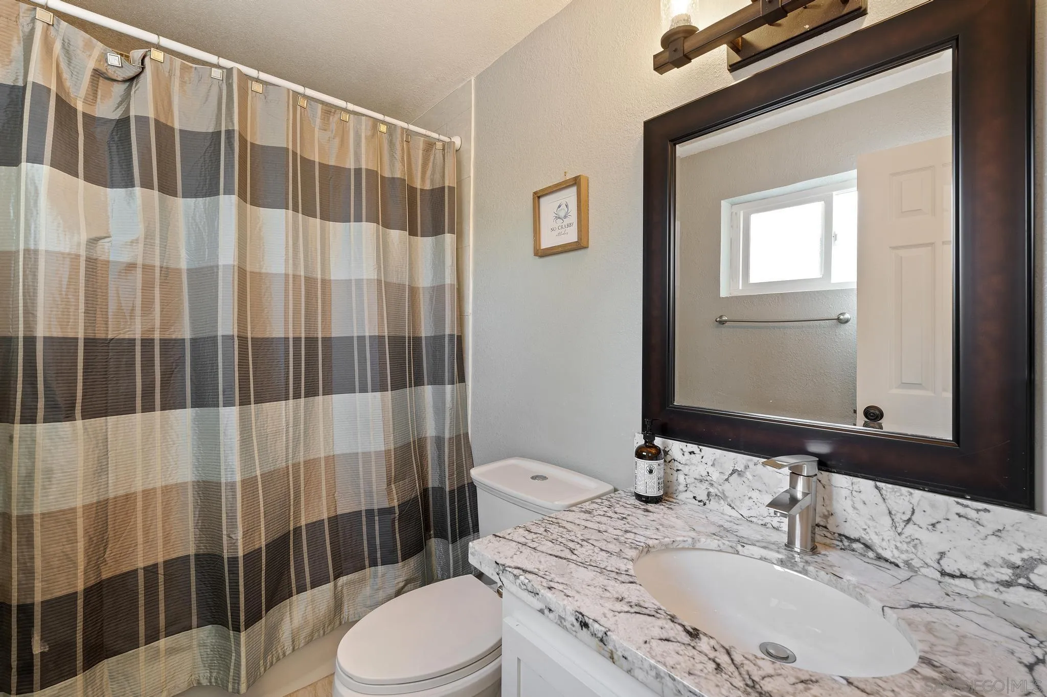 14433 Range Park Road Poway, CA 92064 - Photo 29 of 46 a bathroom with a sink toilet and shower