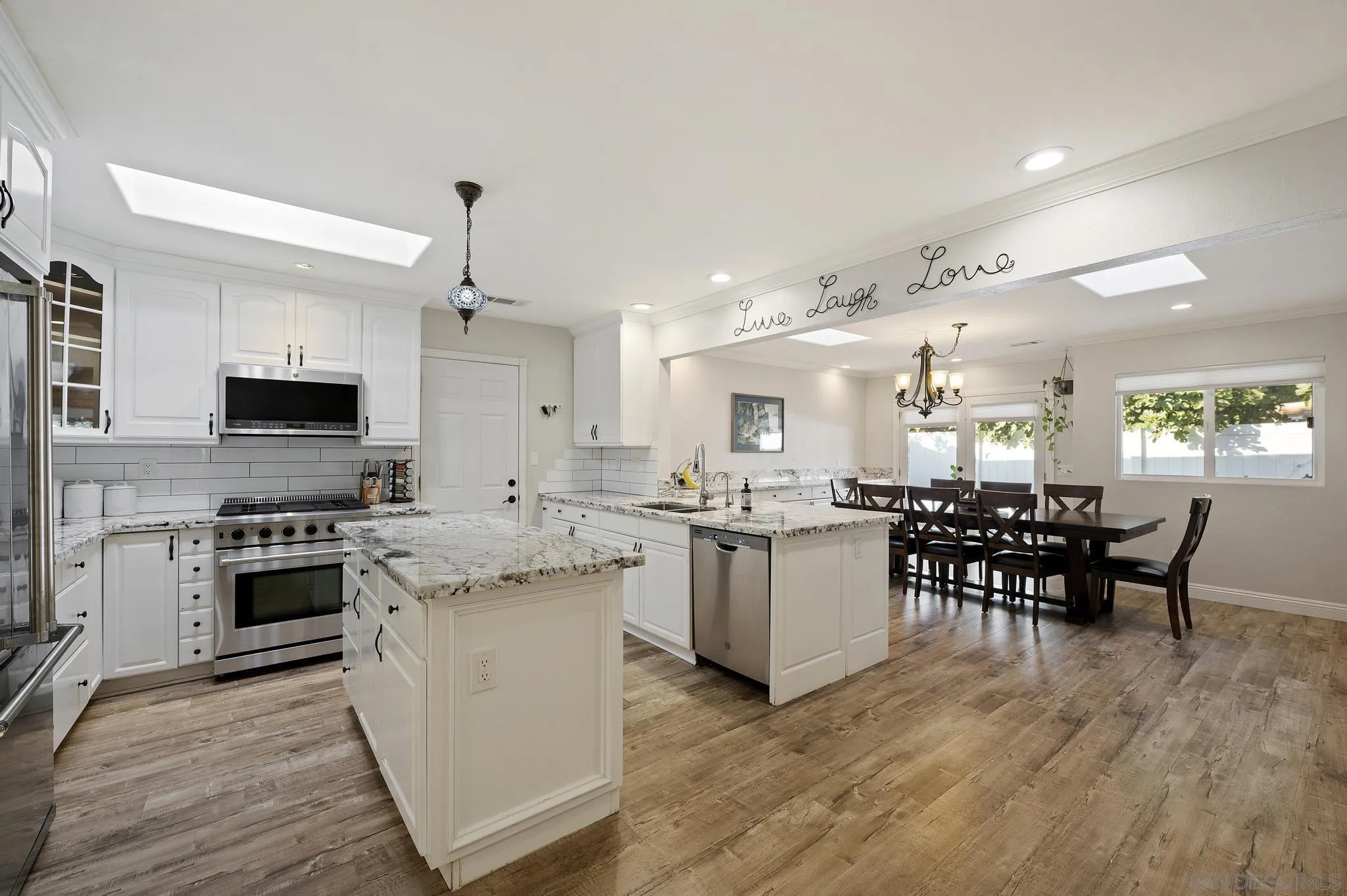 14433 Range Park Road Poway, CA 92064 - Photo 4 of 46 a kitchen with sink cabinets and wooden floor