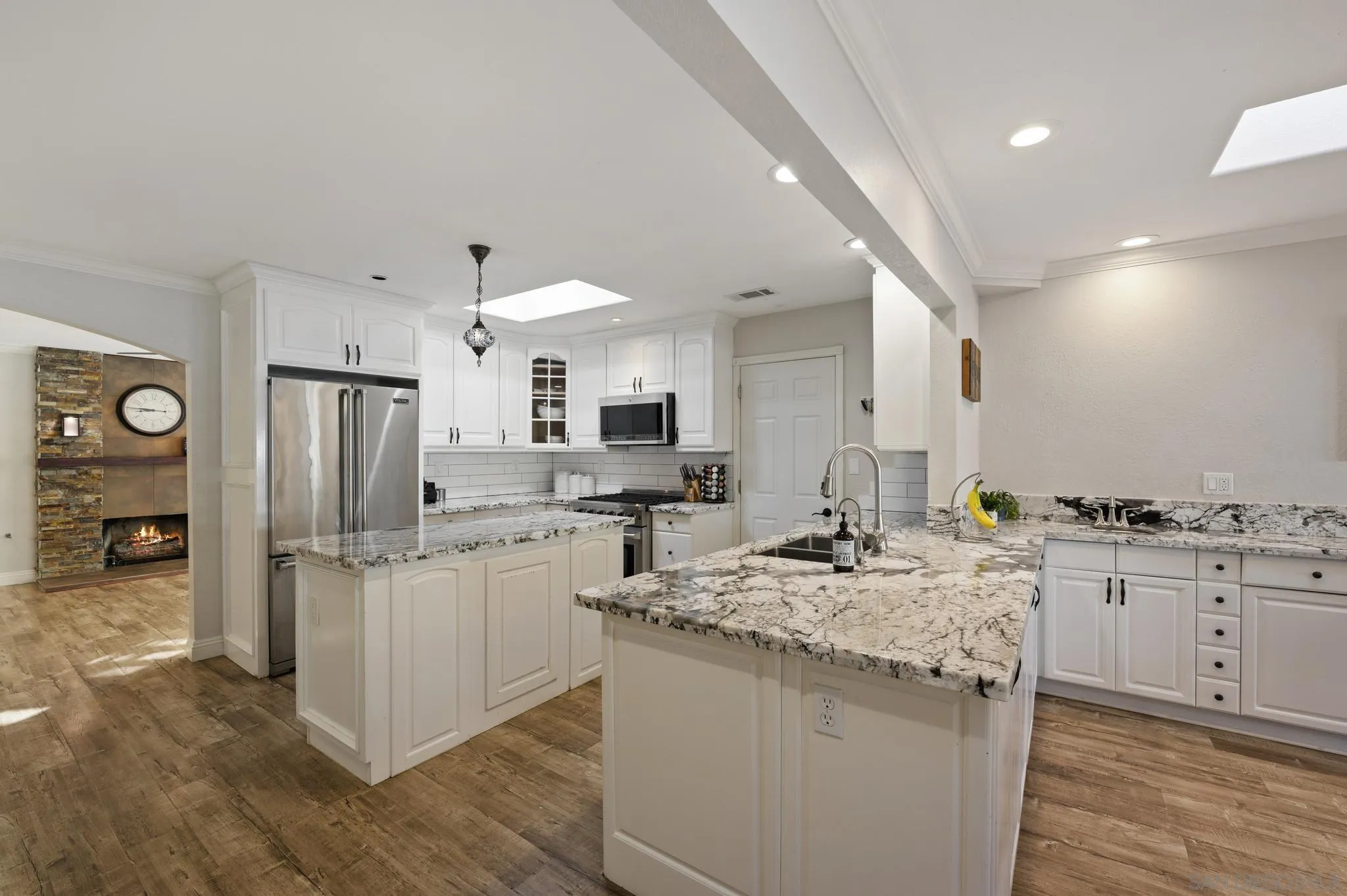14433 Range Park Road Poway, CA 92064 - Photo 5 of 46 a kitchen with stainless steel appliances granite countertop a sink stove and refrigerator