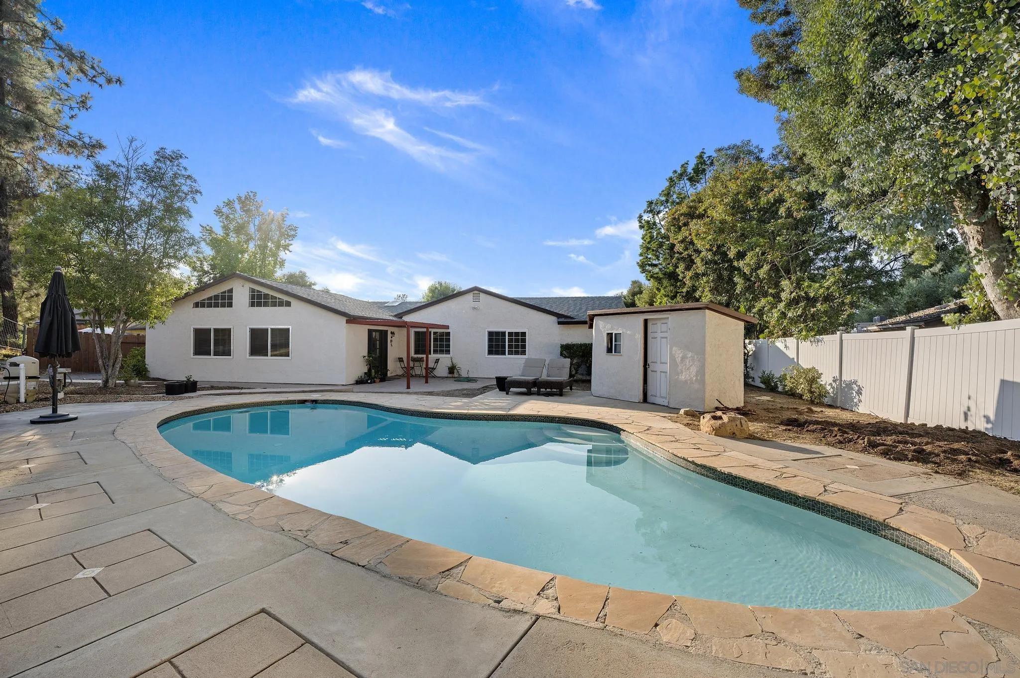 14433 Range Park Road Poway, CA 92064 - Photo 9 of 46 a front view of a house with swimming pool