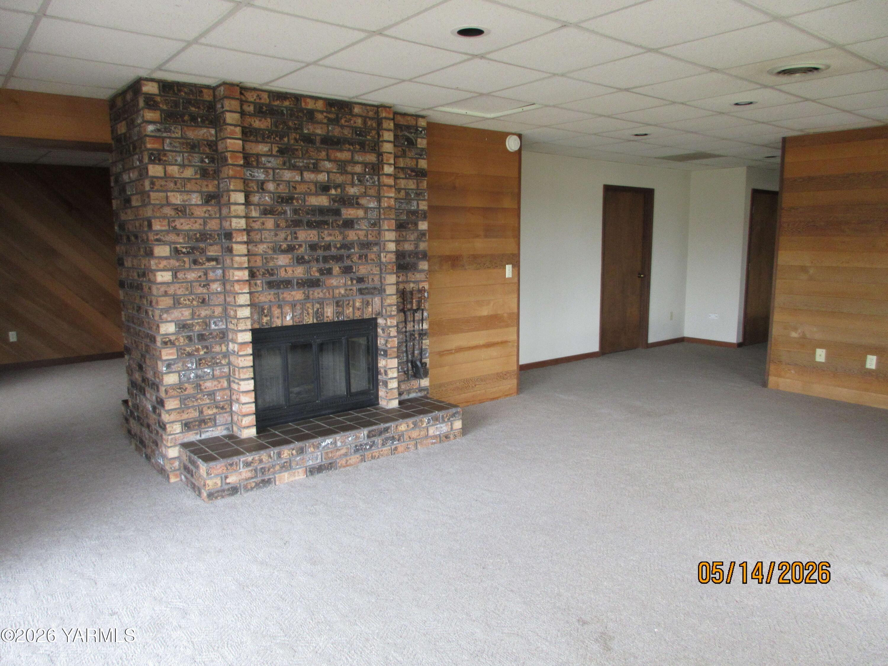 1303 Nightingale Road Wapato, WA 98951 - Photo 14 of 26 a view of empty room with fireplace
