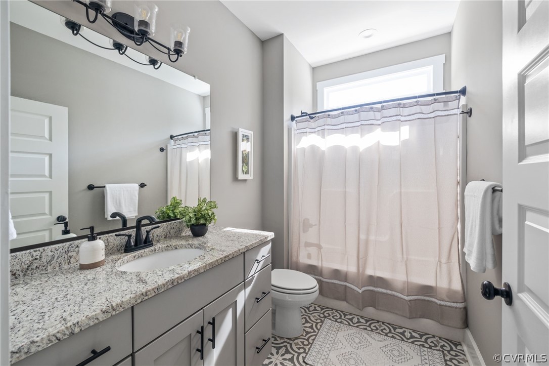 3925 Old Ridge Road Farmville, VA 23901 - Photo 32 of 50 a bathroom with a granite countertop sink toilet and shower