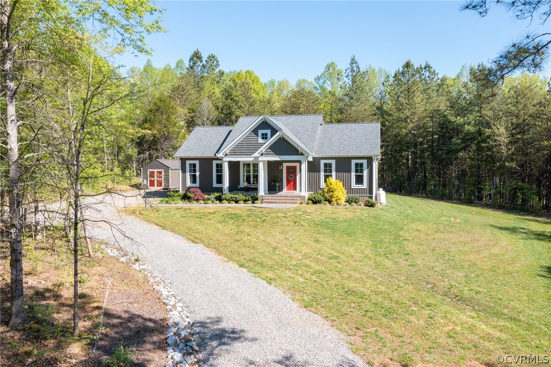 3925 Old Ridge Road Farmville, VA 23901 - Photo 44 of 50 a front view of a house with a yard table and chairs