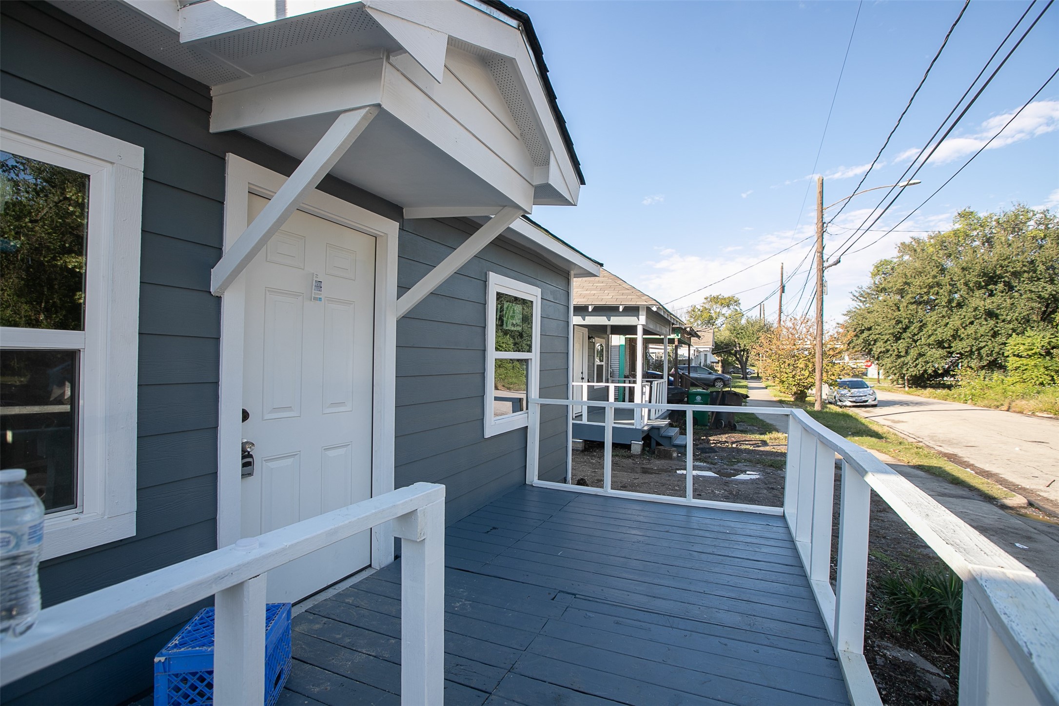 3120 Stonewall Street Houston, TX 77020 - Photo 1 of 18 a view of a patio with table and chairs with wooden floor and fence