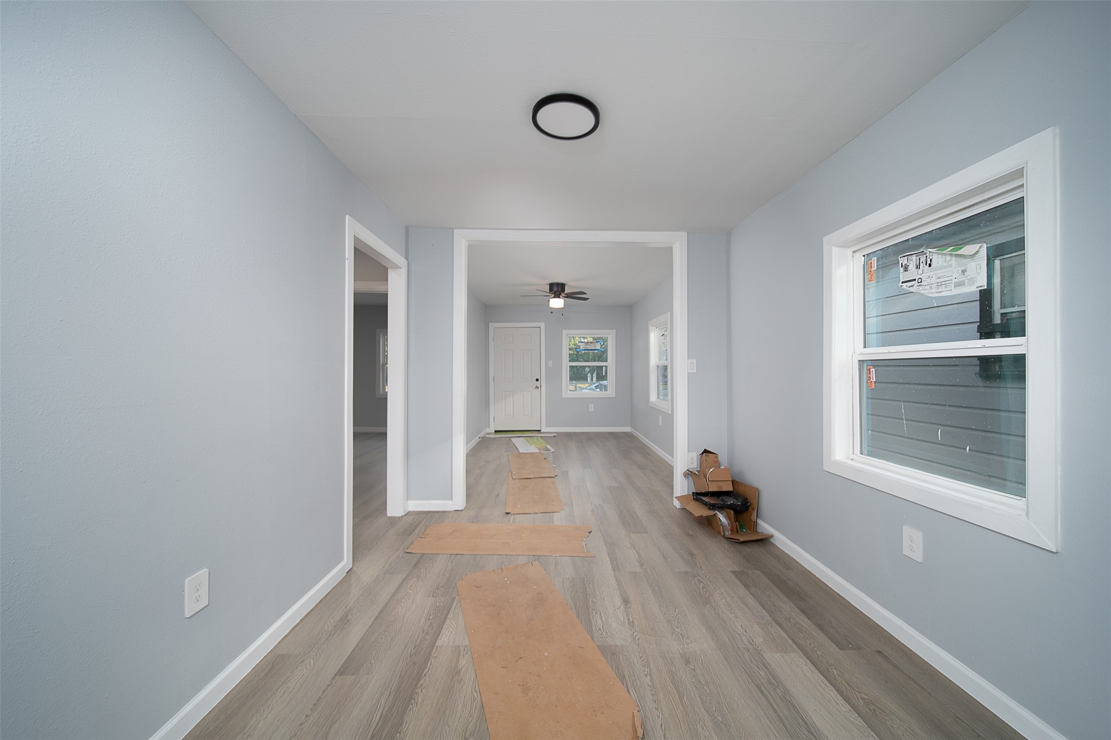3120 Stonewall Street Houston, TX 77020 - Photo 13 of 18 a view of empty room with wooden floor and fan