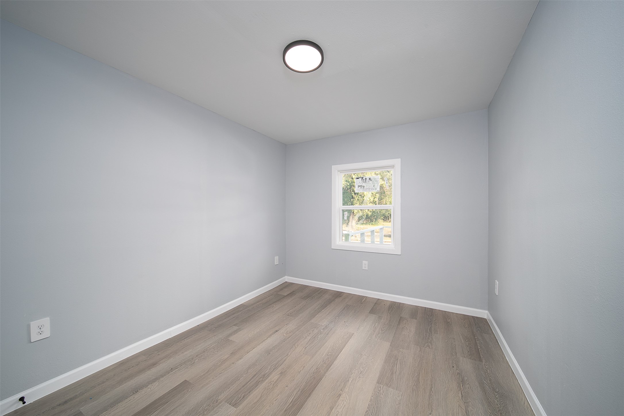 3120 Stonewall Street Houston, TX 77020 - Photo 2 of 18 a view of a room that has wooden floor and a window