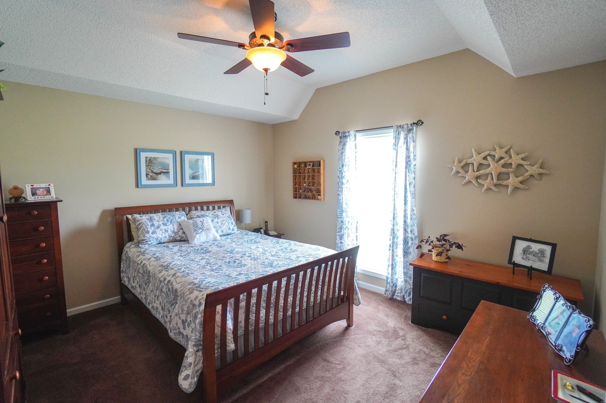 1890 Clara Mathis Road Spring Hill, TN 37174 - Photo 11 of 45 a bedroom with a bed and a chandelier