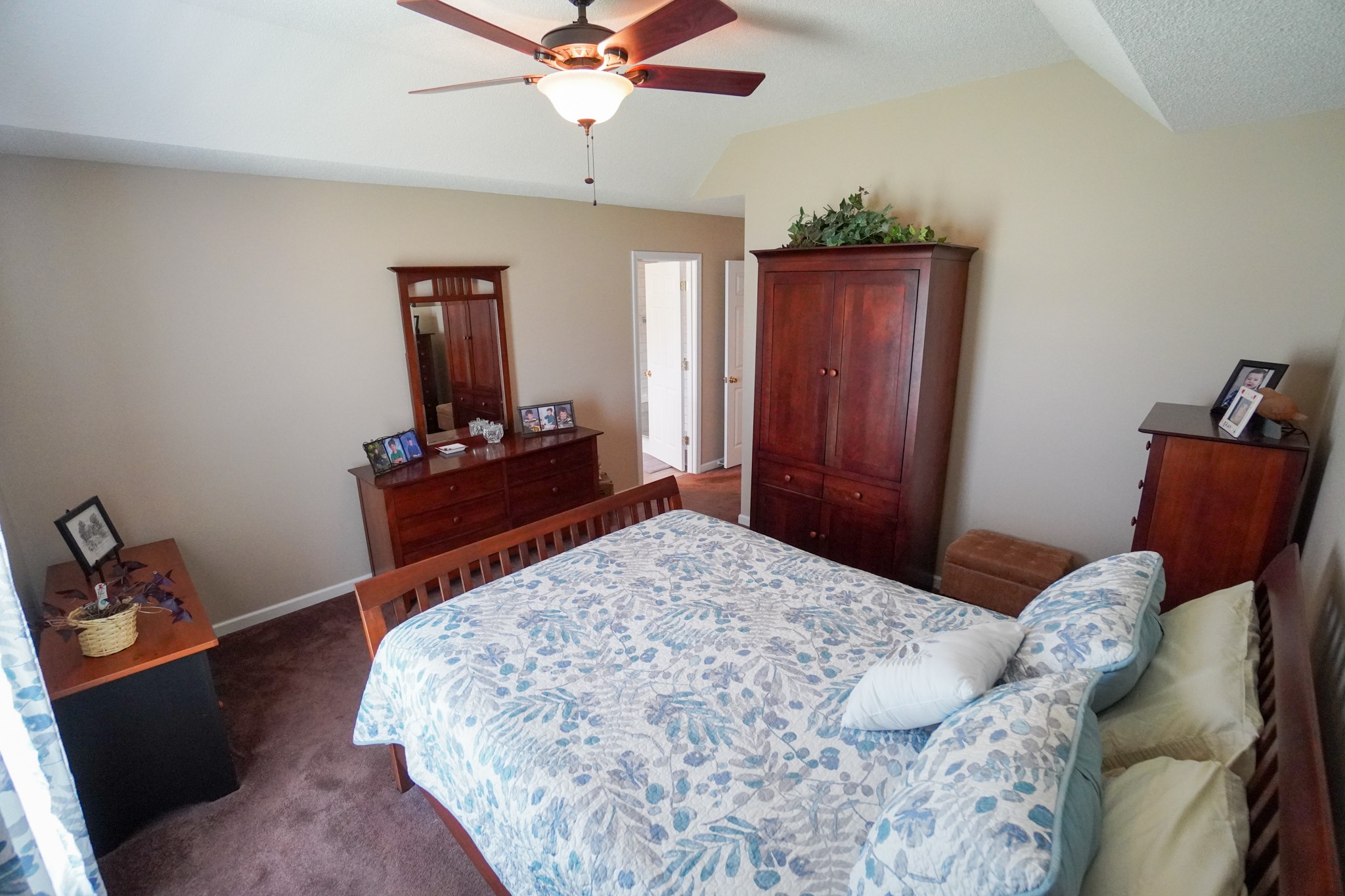 1890 Clara Mathis Road Spring Hill, TN 37174 - Photo 13 of 45 a bedroom with a bed and a dresser in it
