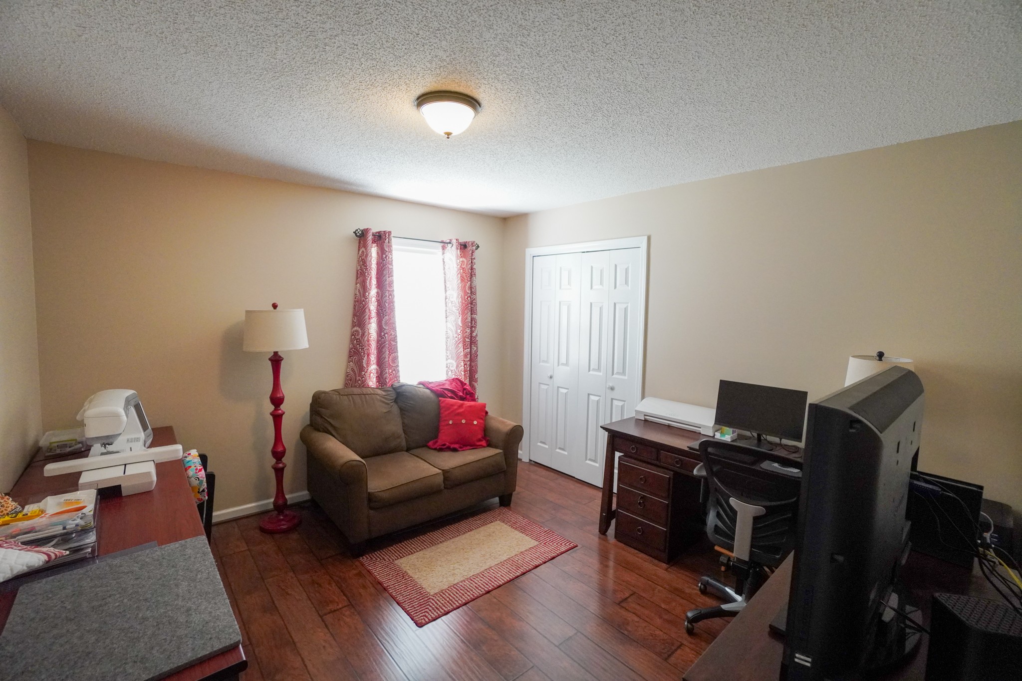 1890 Clara Mathis Road Spring Hill, TN 37174 - Photo 16 of 45 a living room with furniture and a flat screen tv