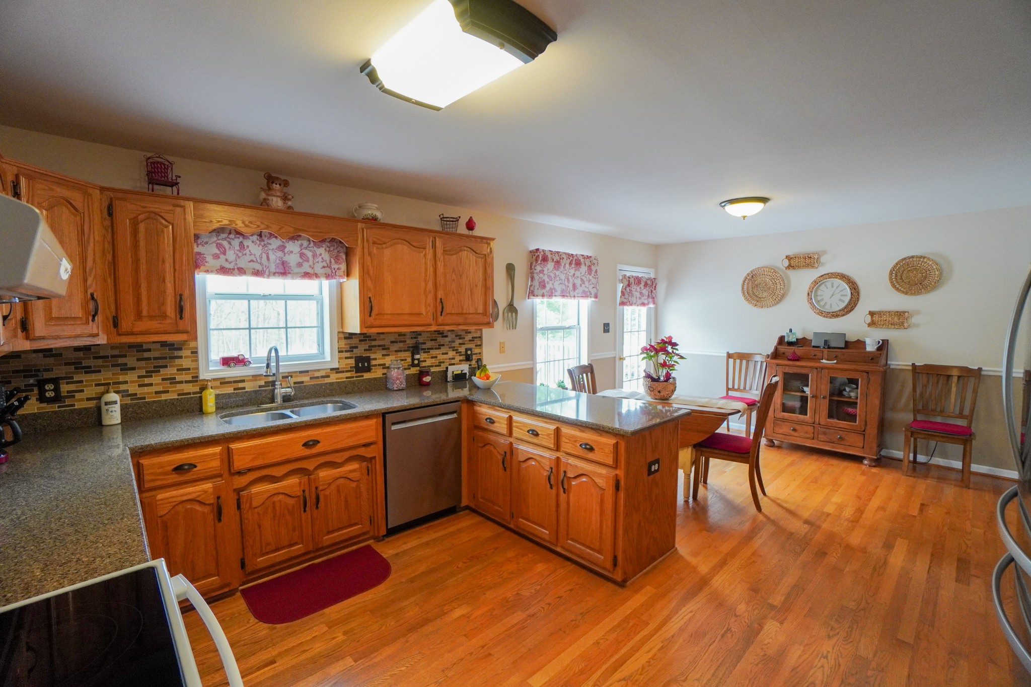 1890 Clara Mathis Road Spring Hill, TN 37174 - Photo 19 of 45 a kitchen with wooden cabinets and sink