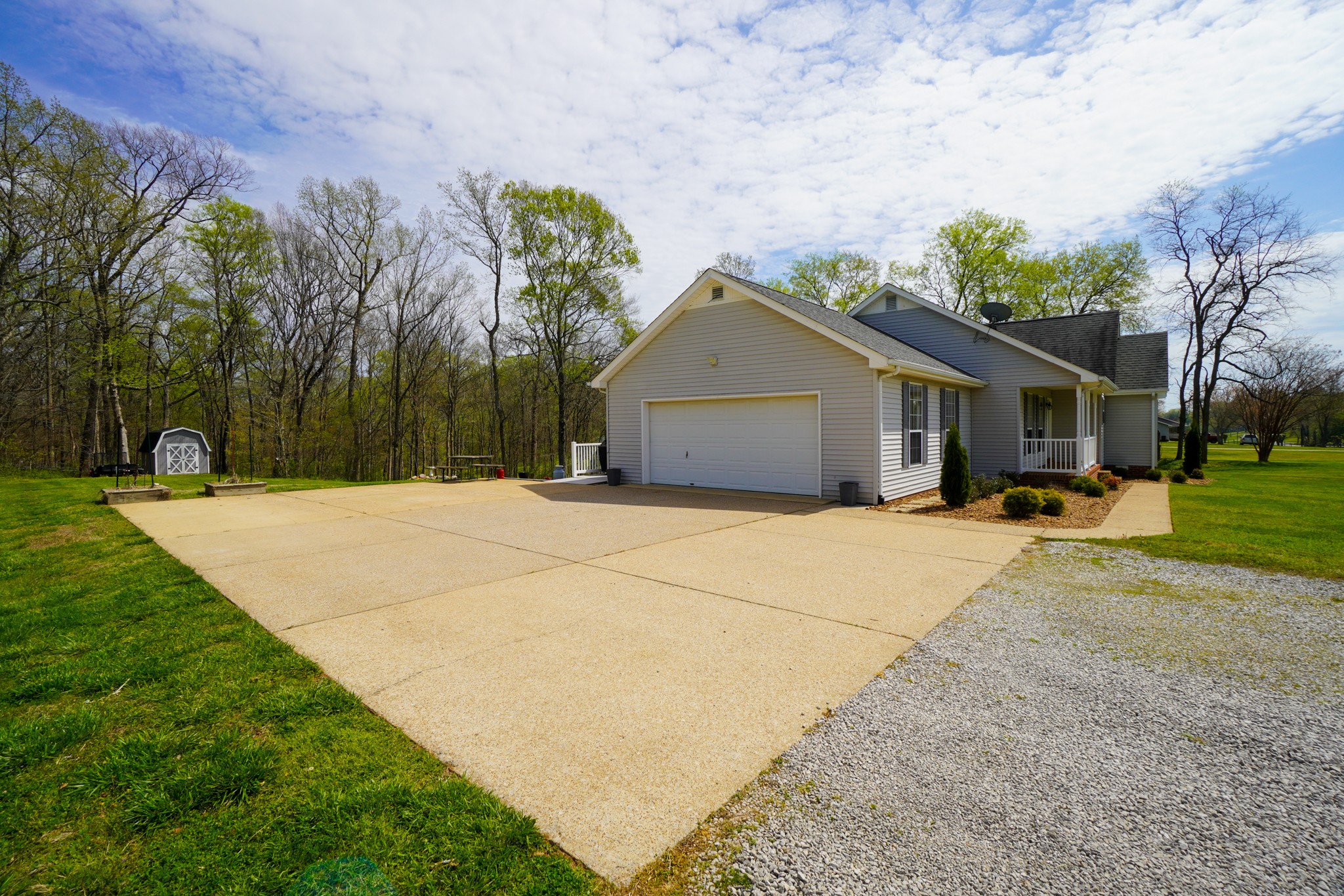 1890 Clara Mathis Road Spring Hill, TN 37174 - Photo 28 of 45 a front view of a house with a yard and trees