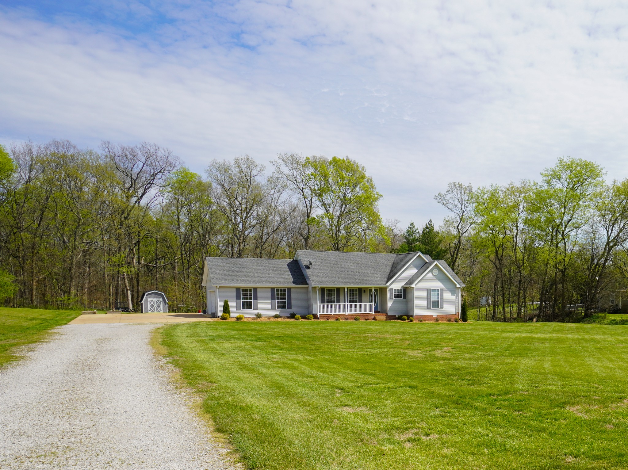 1890 Clara Mathis Road Spring Hill, TN 37174 - Photo 3 of 45 a front view of a house with a garden