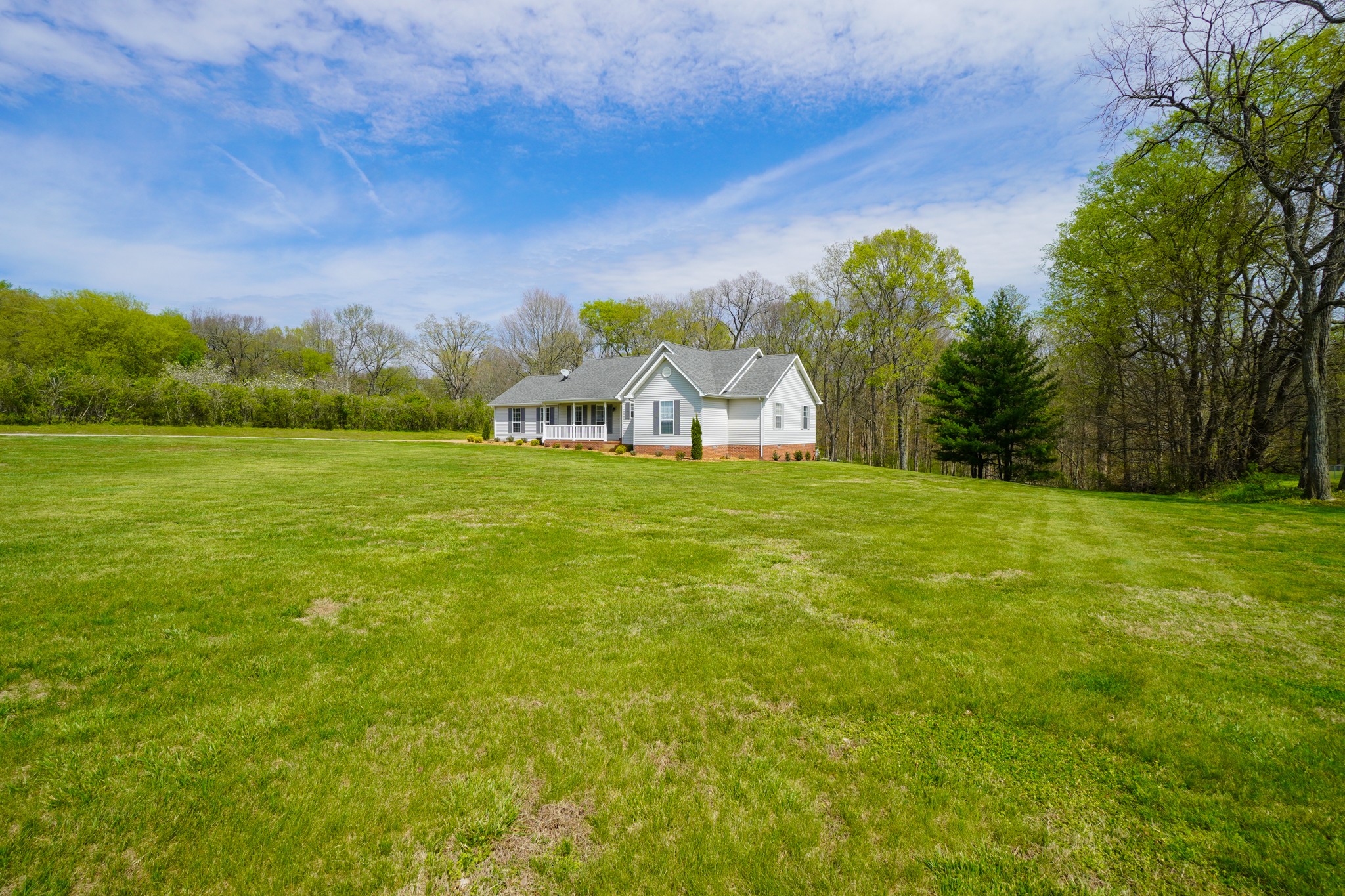 1890 Clara Mathis Road Spring Hill, TN 37174 - Photo 32 of 45 a view of a big yard with a house in the background