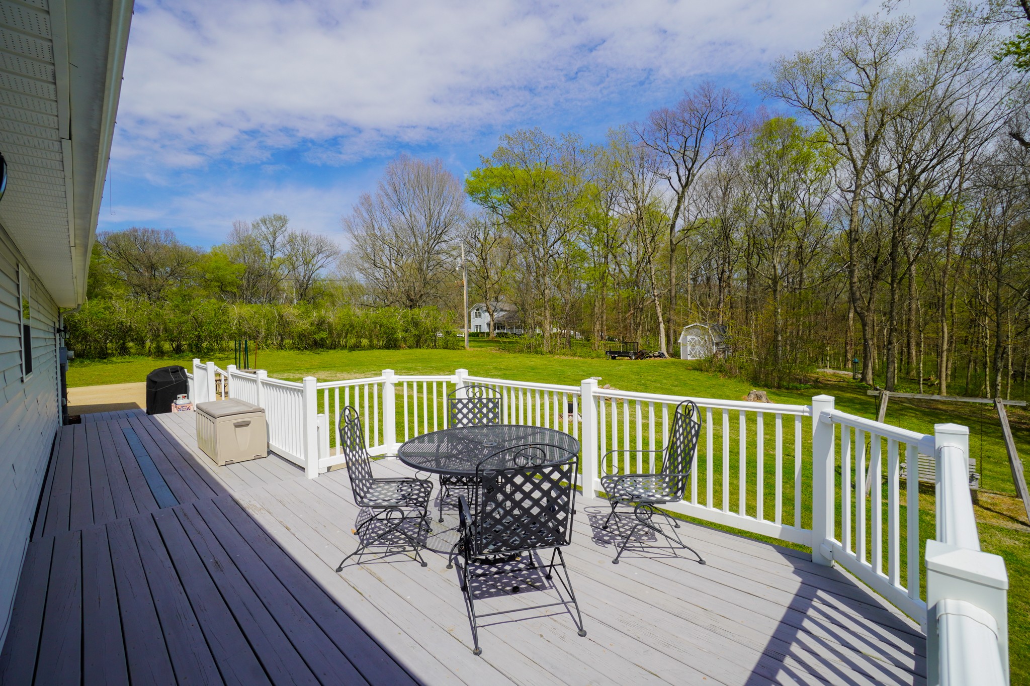 1890 Clara Mathis Road Spring Hill, TN 37174 - Photo 41 of 45 a view of a deck with two chair and a table