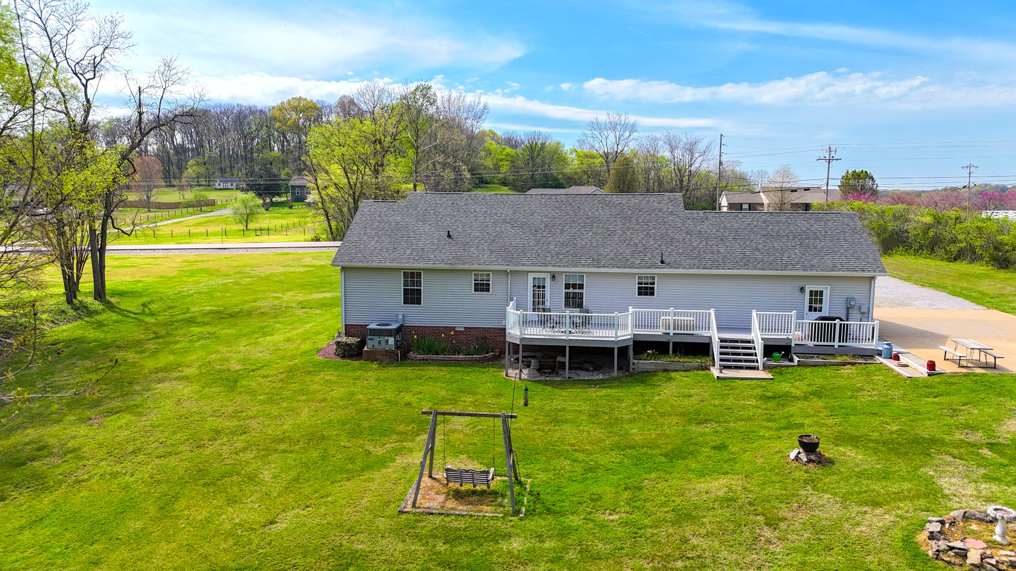 1890 Clara Mathis Road Spring Hill, TN 37174 - Photo 44 of 45 a view of a house with a yard porch and sitting area