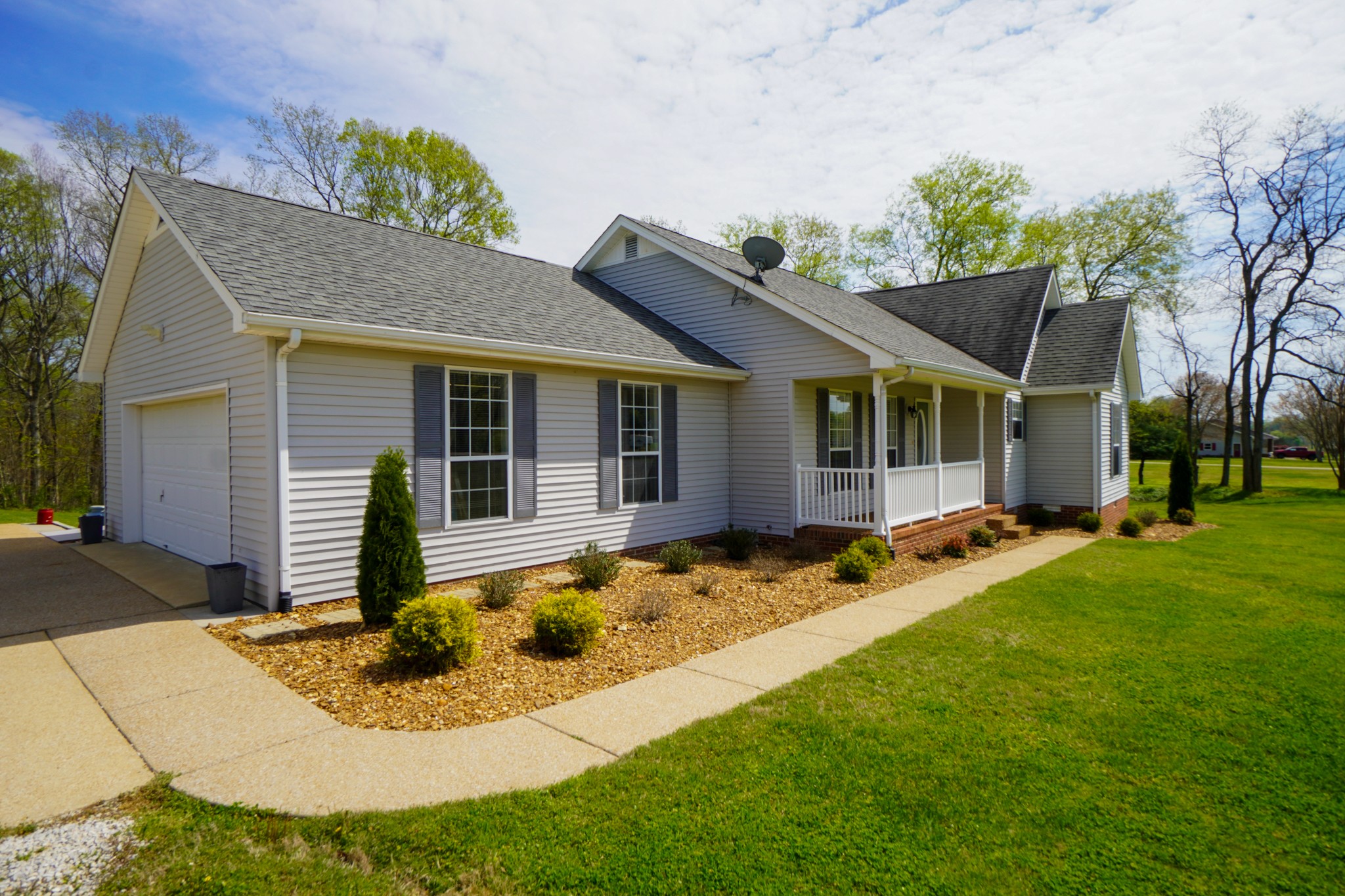 1890 Clara Mathis Road Spring Hill, TN 37174 - Photo 5 of 45 a front view of house with yard outdoor seating and green space