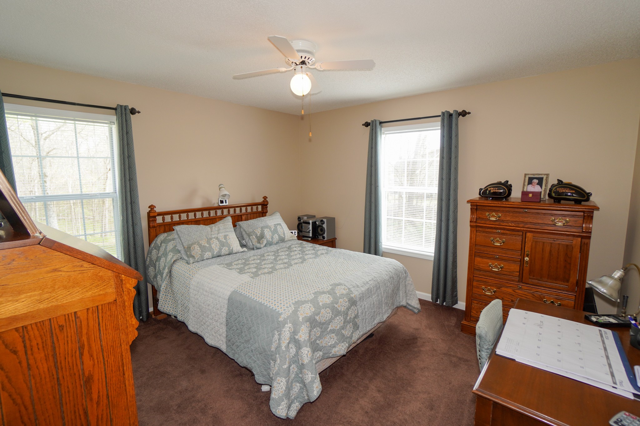 1890 Clara Mathis Road Spring Hill, TN 37174 - Photo 10 of 45 a bedroom with a bed and dresser with mirror