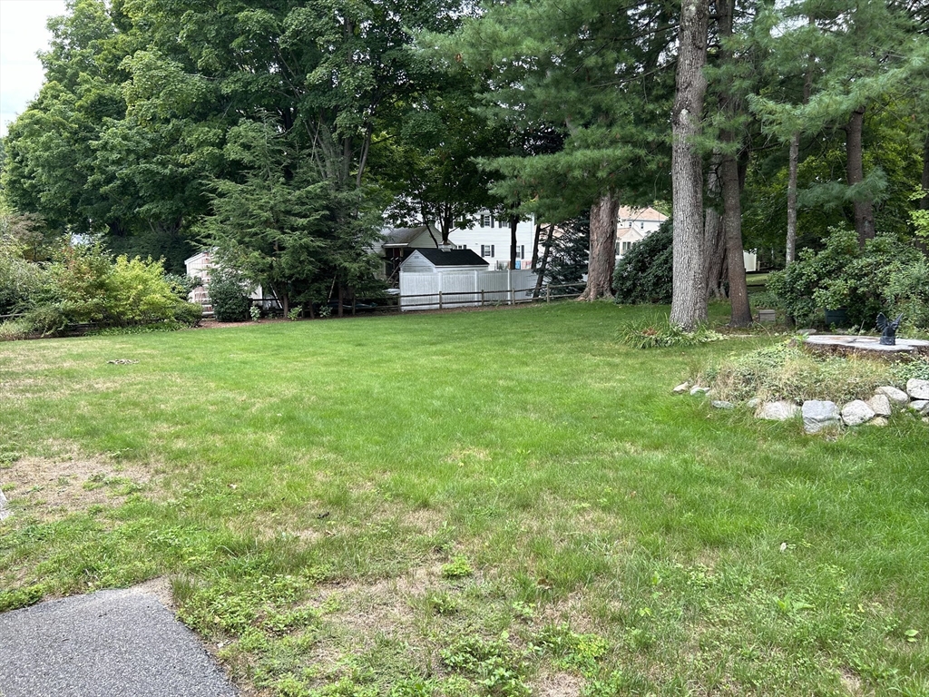 67 Spruce Road Reading, MA 01867 - Photo 4 of 4 a view of a house with backyard and garden