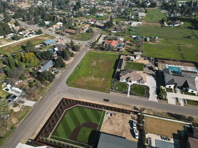an aerial view of a houses with outdoor space