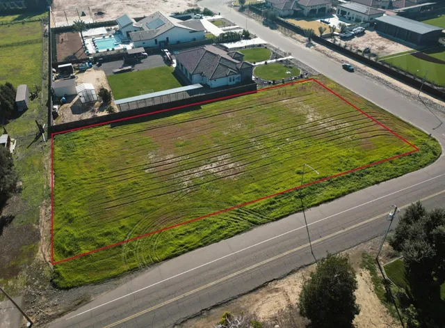 a view of a pool an outdoor seating