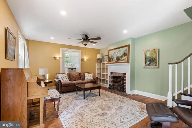 a living room with fireplace furniture and a fireplace