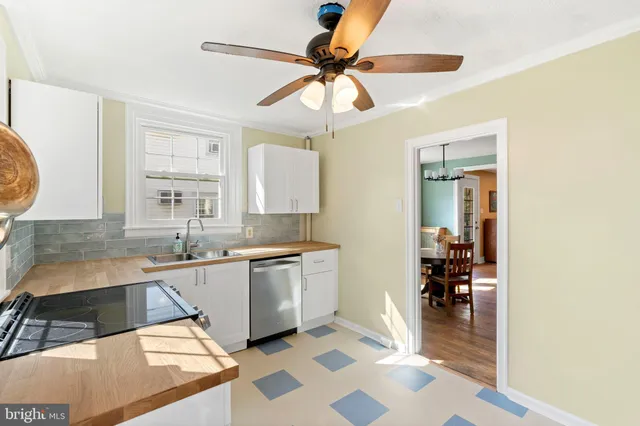 a kitchen with stainless steel appliances granite countertop a sink and cabinets