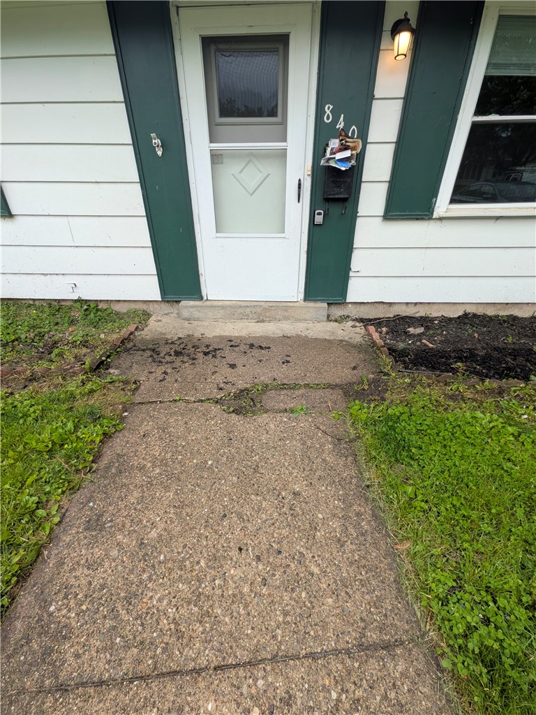 840 Brookfield Road Kettering, OH 45429 - Photo 2 of 13 The home's exterior features a practical entrance with classic siding and a welcoming porch light.