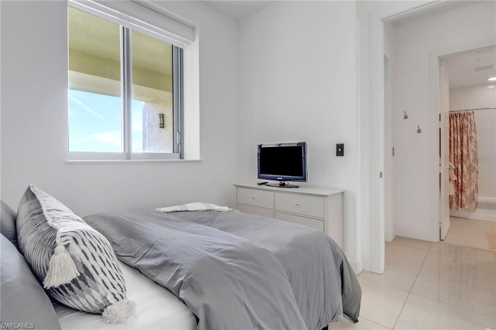 3000 Oasis Grand Boulevard, Unit MPH6 Fort Myers, FL 33916 - Photo 20 of 44 Bedroom featuring light tile patterned floors