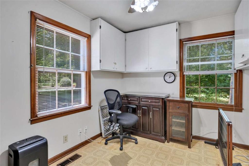 103 Gabriel Way Social Circle, GA 30025 - Photo 36 of 70 a view of a workspace with furniture and a window