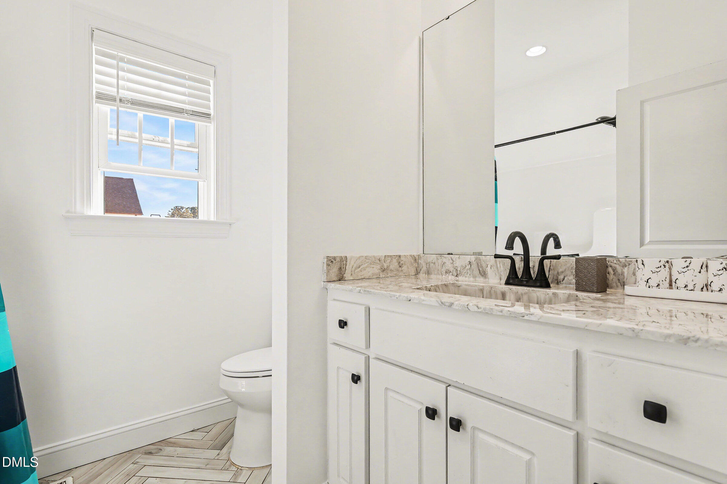 5117 Joe Ellen Road Battleboro, NC 27809 - Photo 14 of 23 a bathroom with a granite countertop sink toilet and mirror