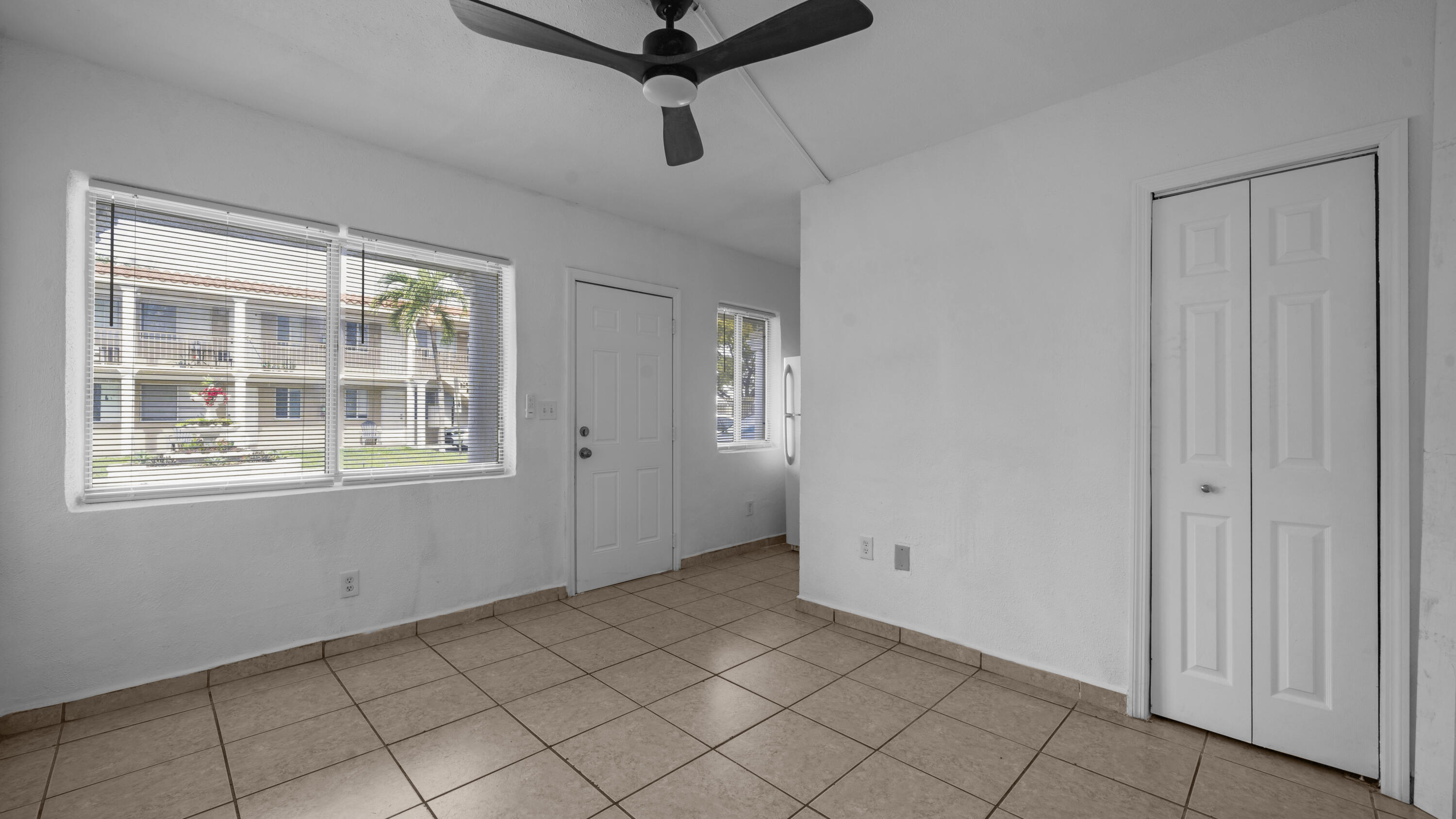 420 Northwest 10th Street, Unit 9 Miami, FL 33136 - Photo 3 of 14 a view of an empty room with a window