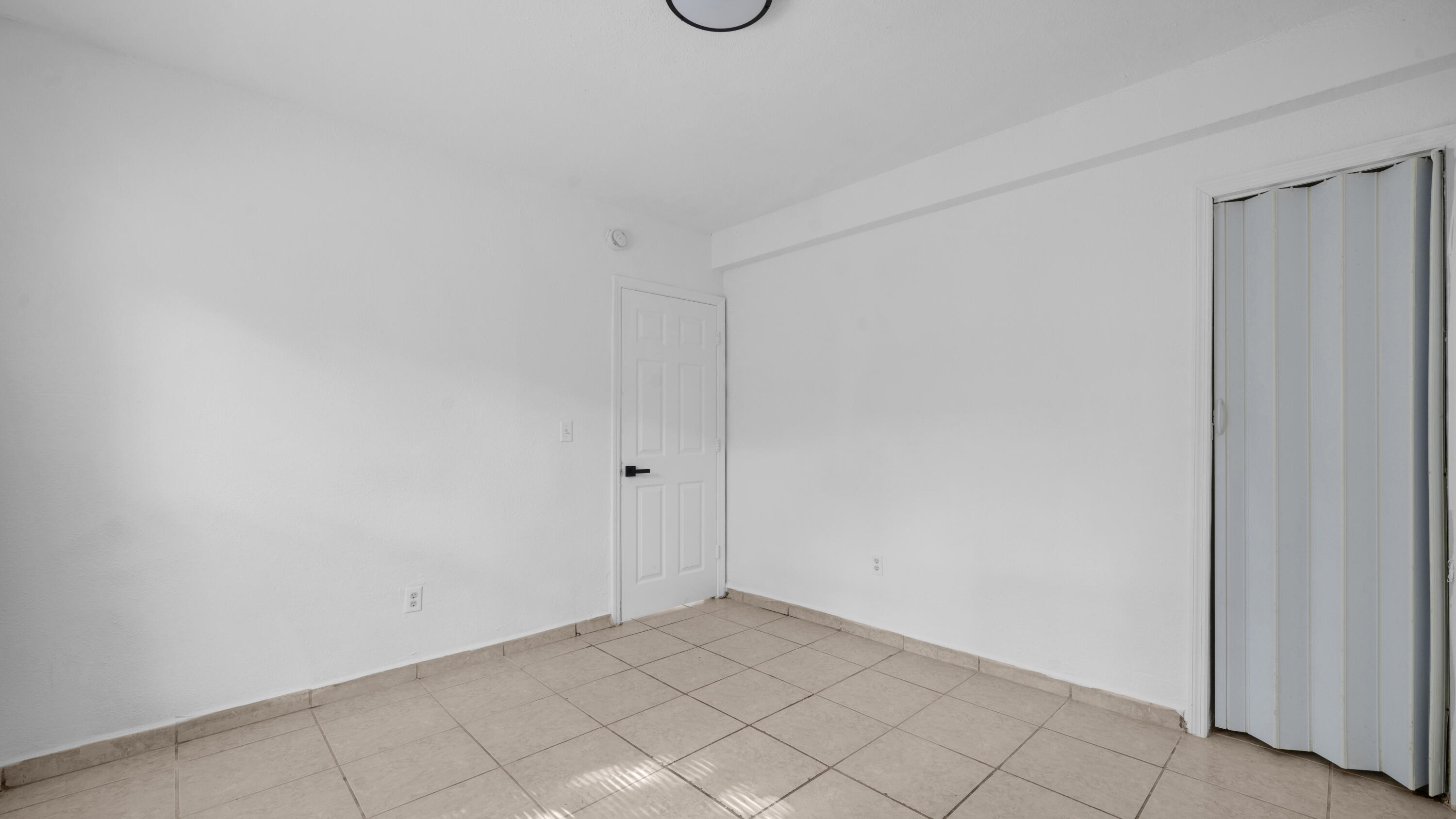 420 Northwest 10th Street, Unit 9 Miami, FL 33136 - Photo 10 of 14 a view of an empty room