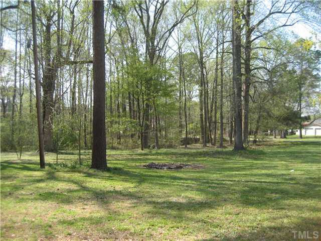 7500 Rock Service Station Road Raleigh, NC 27603 - Photo 18 of 21 Beautiful wooded corner lot with hardwood trees and lots of azaleas. Very peaceful and serene.