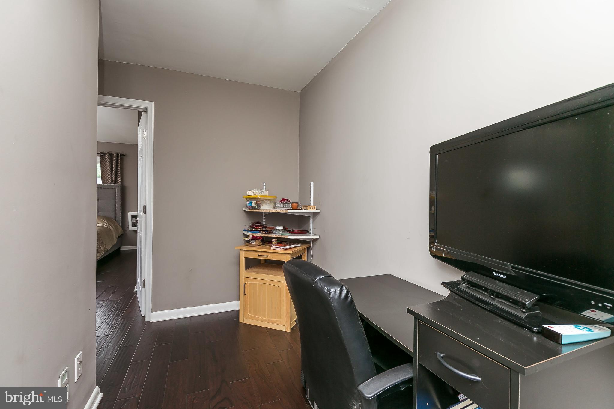 10 Harding Street Lutherville-Timonium, MD 21093 - Photo 19 of 30 a living room with furniture and a flat screen tv