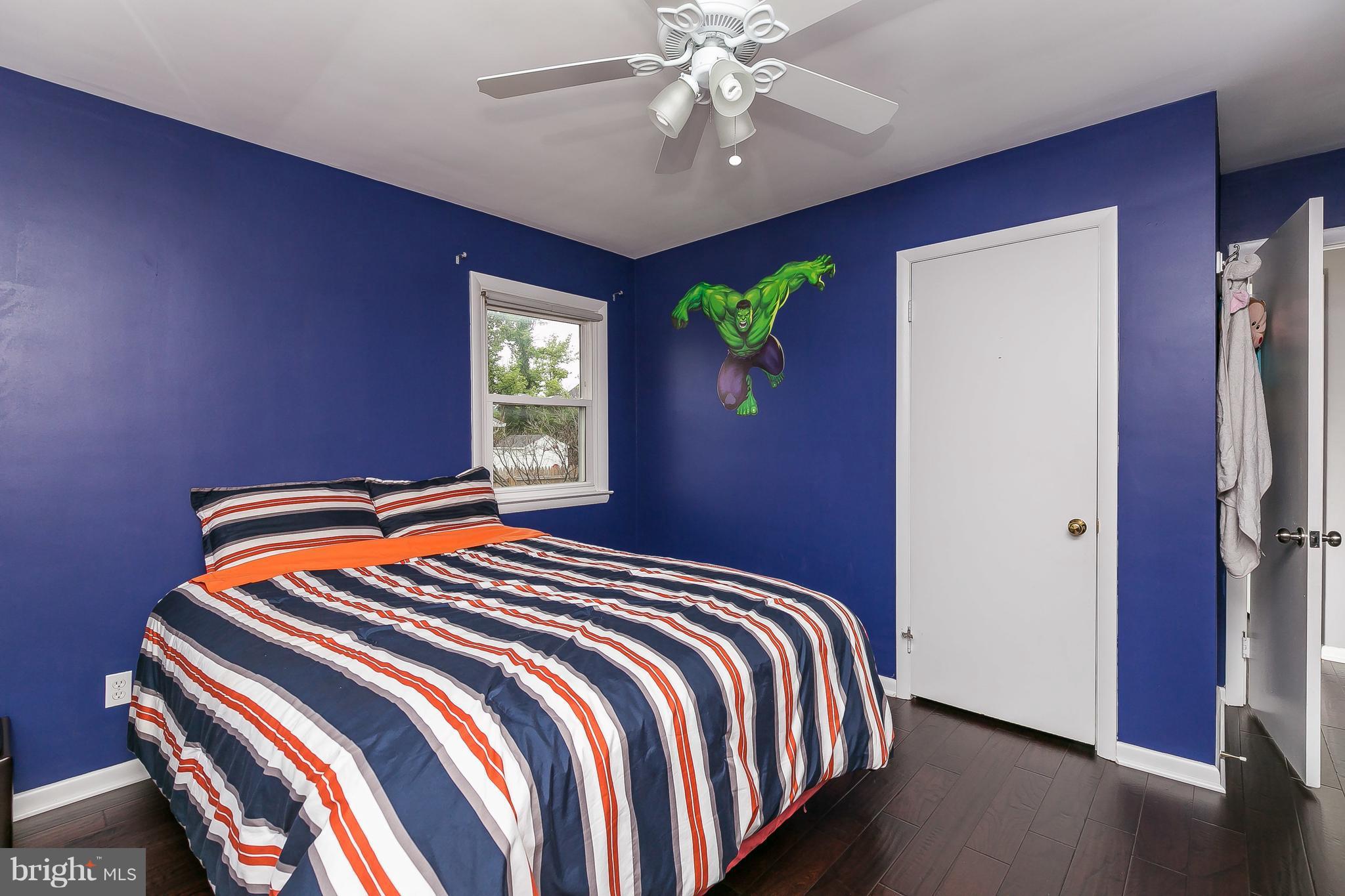 10 Harding Street Lutherville-Timonium, MD 21093 - Photo 27 of 30 a bedroom with a bed and a chandelier
