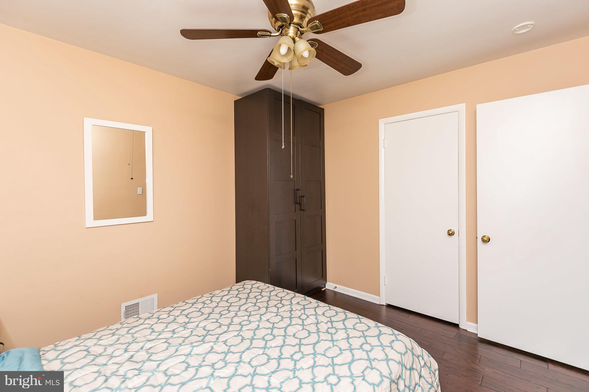 10 Harding Street Lutherville-Timonium, MD 21093 - Photo 29 of 30 a bedroom with a bed and a chandelier fan